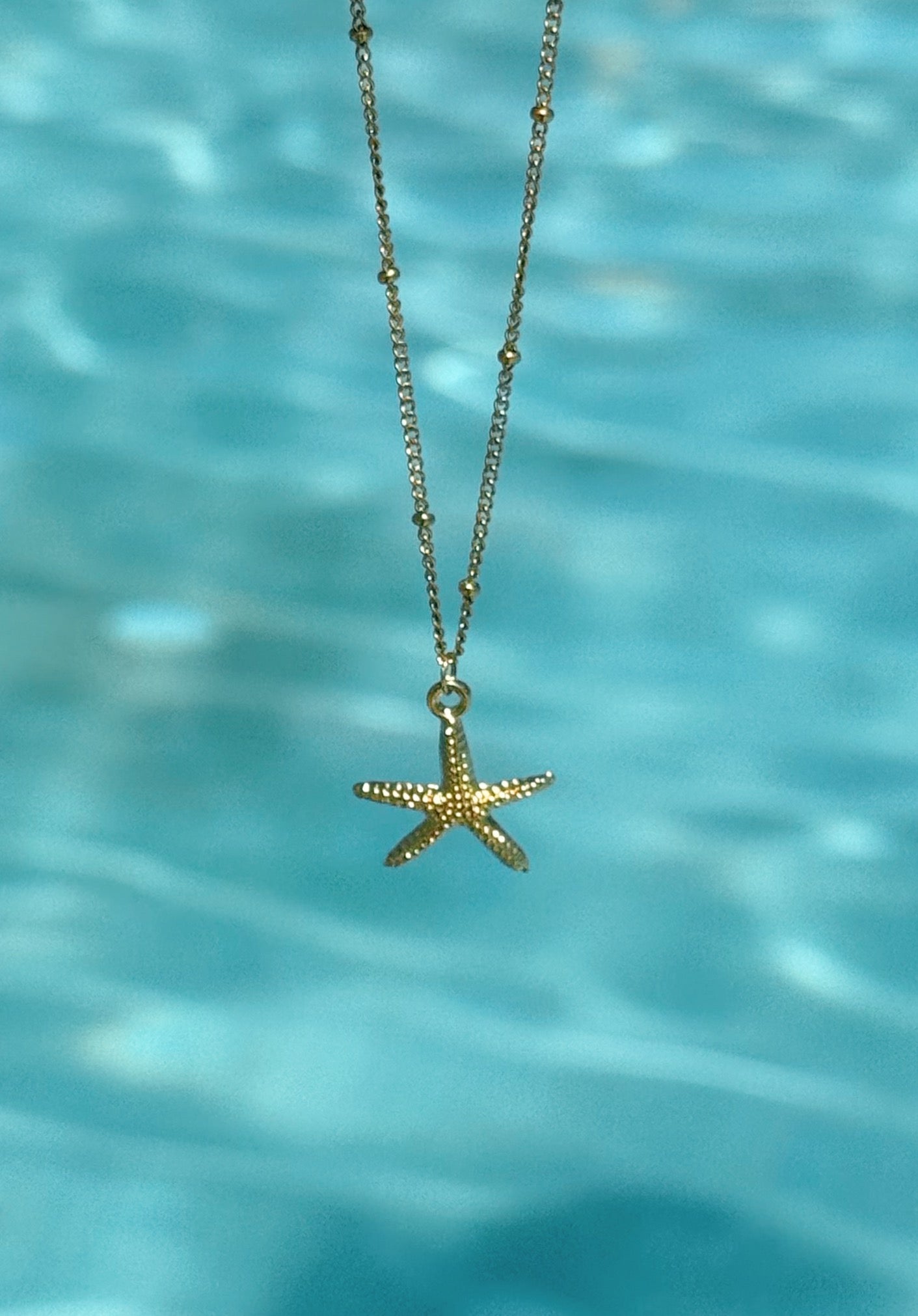 Gold starfish necklace