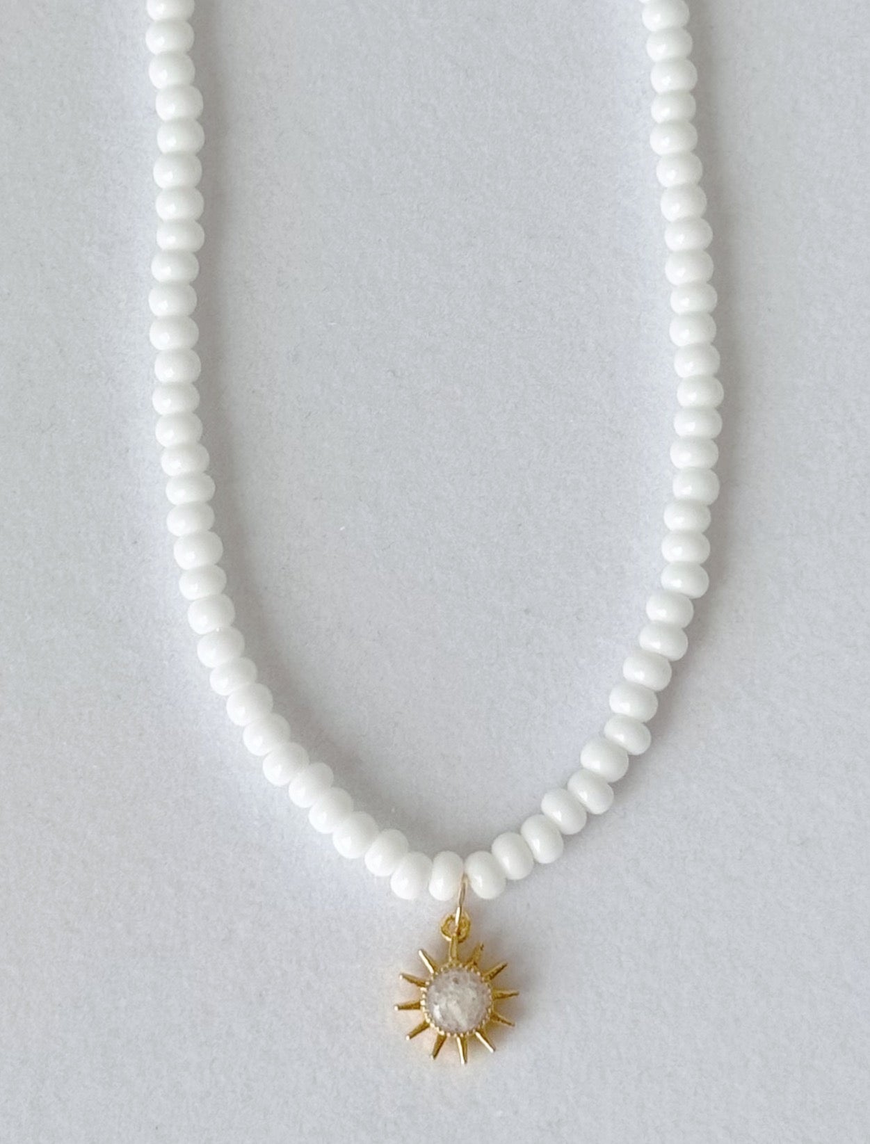 Beaded sun charm necklace
