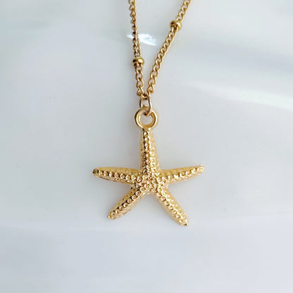 Gold starfish necklace