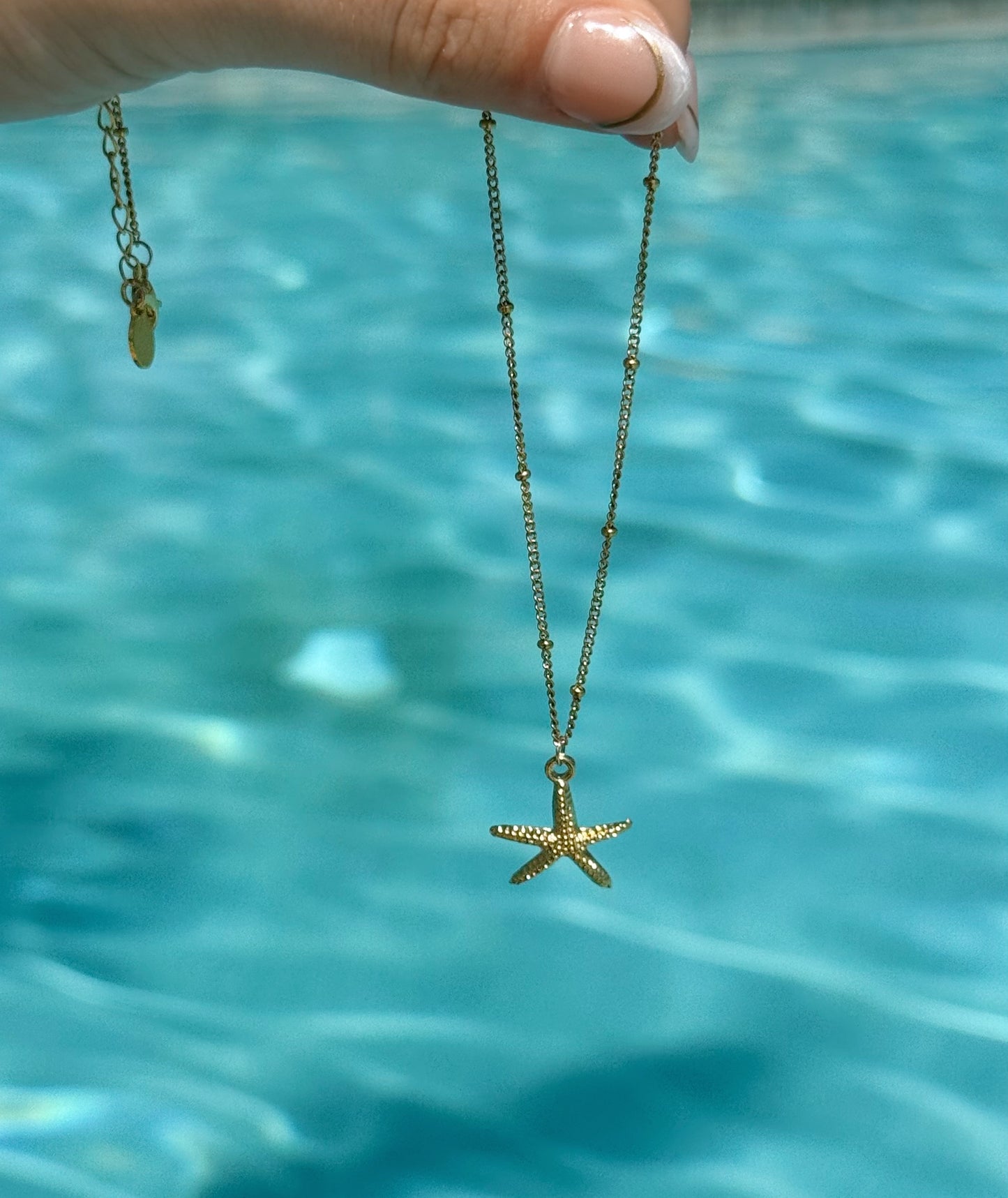 Gold starfish necklace