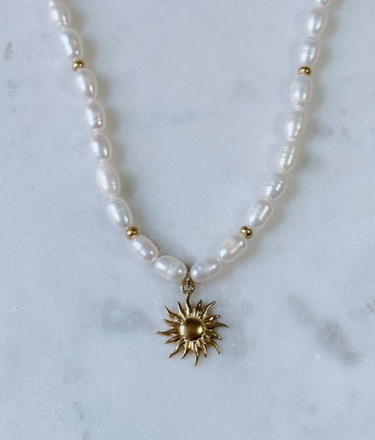 Chunky pearl & gold charm necklace