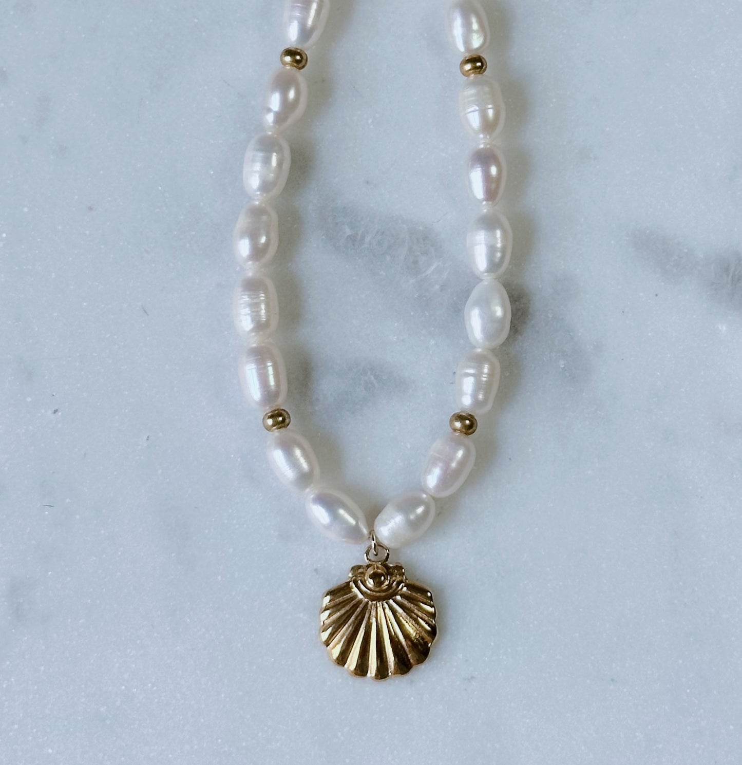 Chunky pearl & gold charm necklace