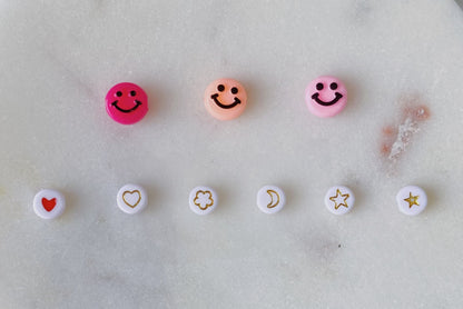 Light pink beaded charm ring