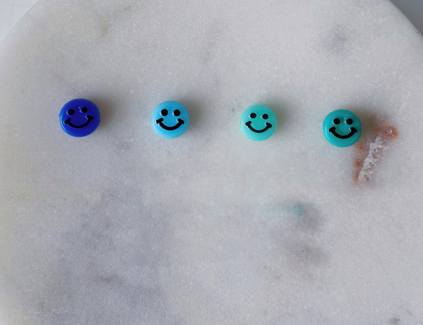 Blue smiley beaded bracelet stack