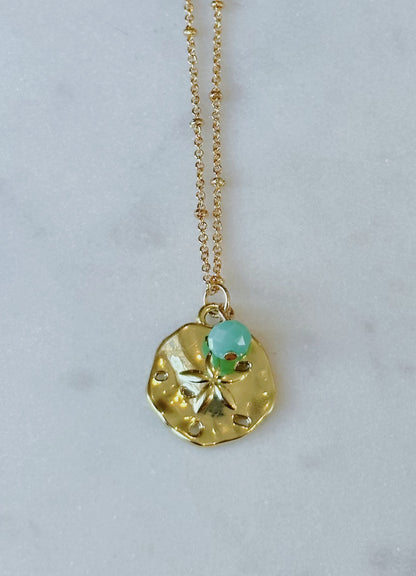 Gold sand dollar necklace