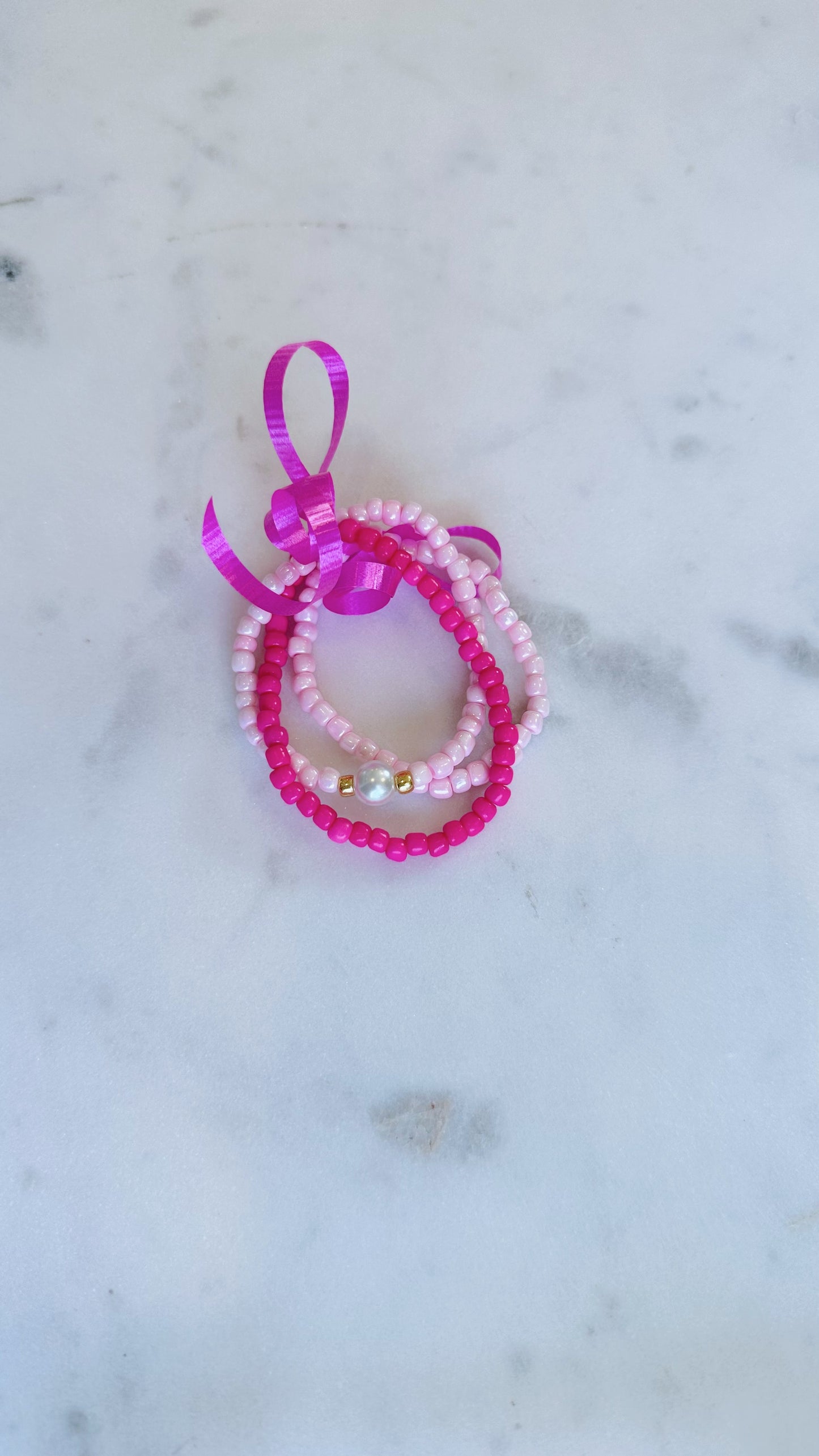 Pink pearl bracelet stack