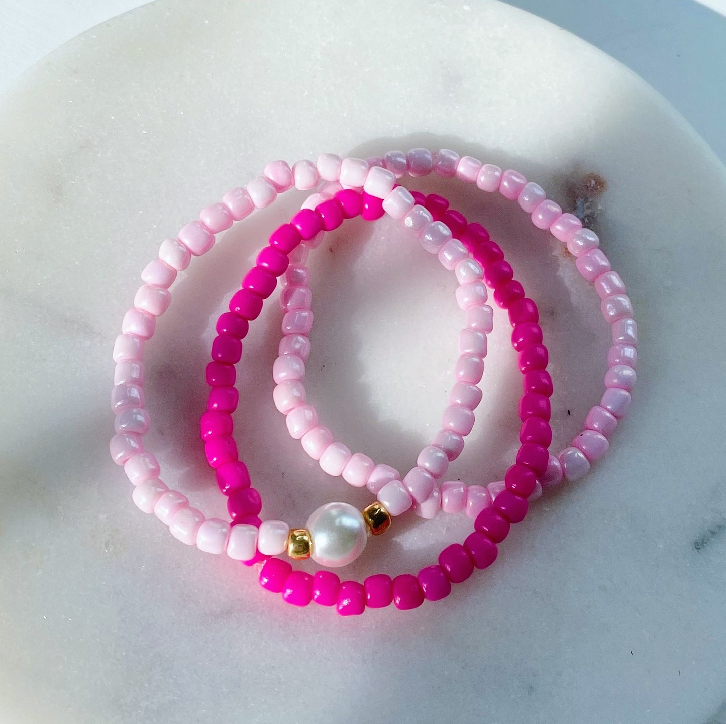 Pink pearl bracelet stack