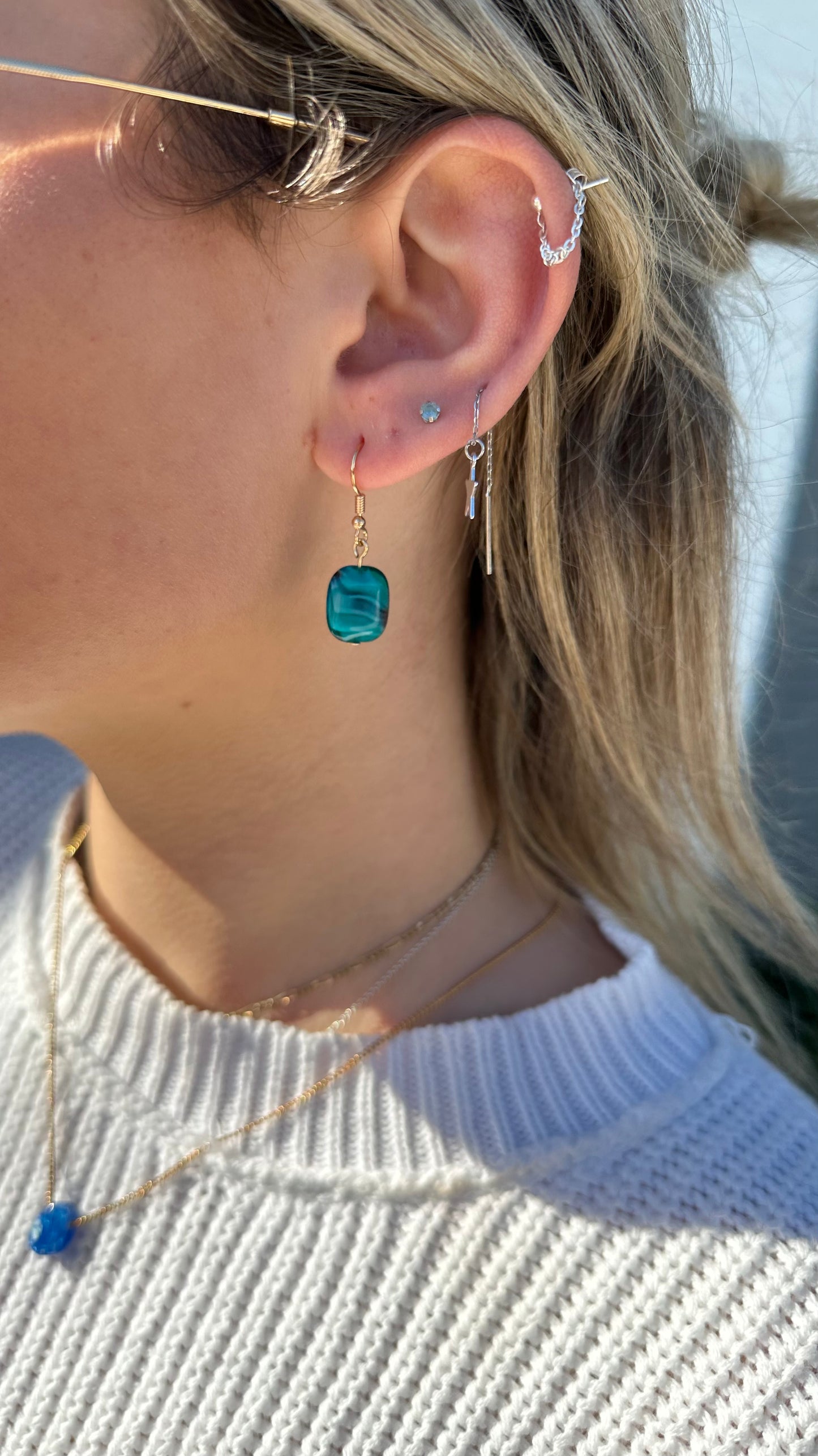 Blue glass swirl dangle earrings