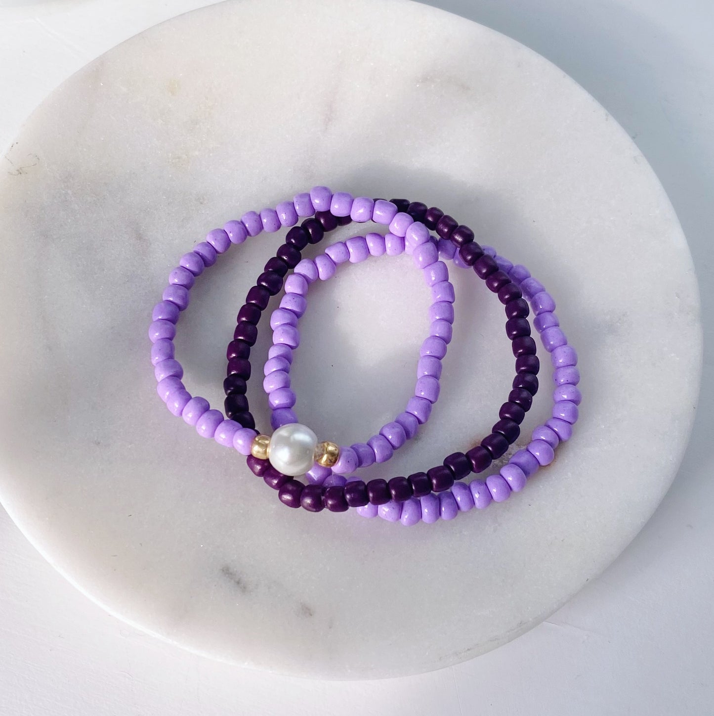 Purple pearl beaded bracelet stack